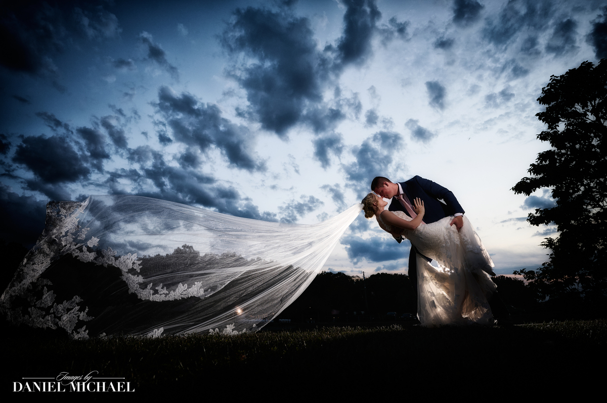 a groom sweeping his bride off her feet
